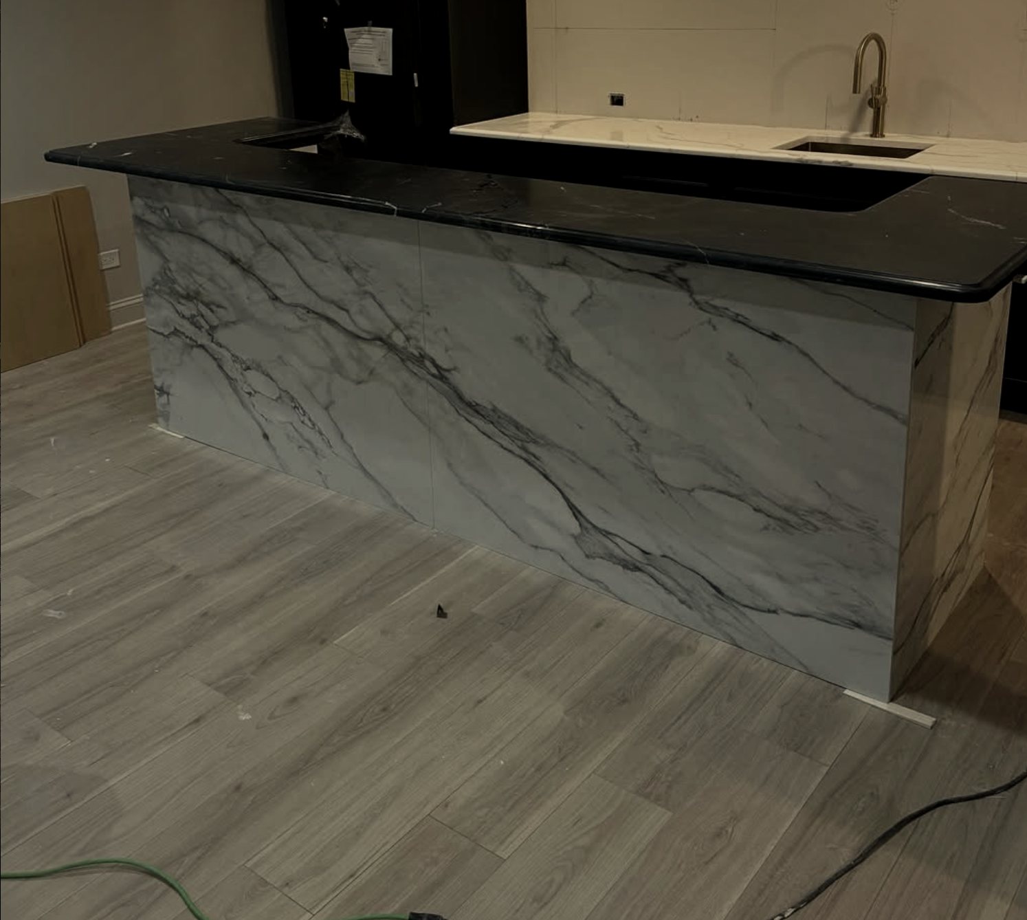 Bar with dark stone top and porcelain panels